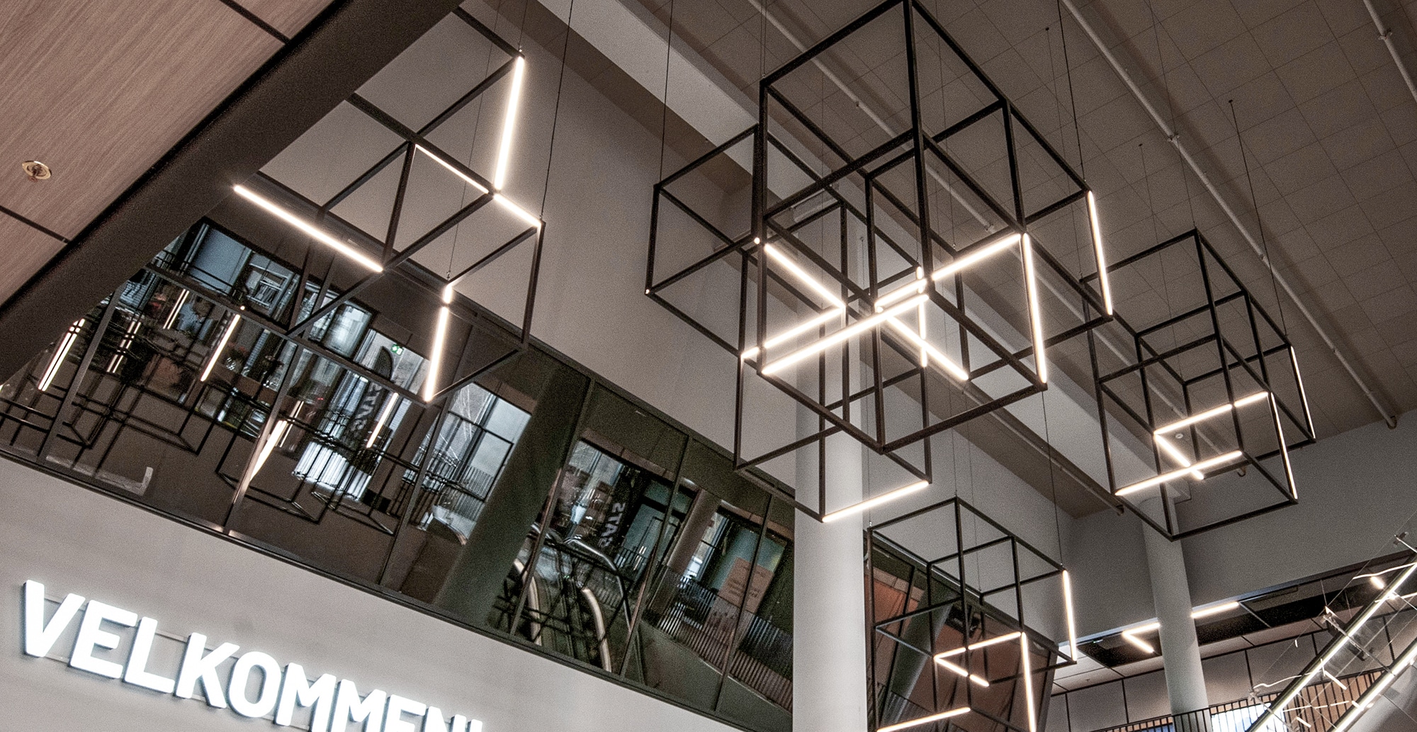 Specially built cubic pendant luminaires at Rortunet shopping center